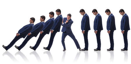 Businessman in domino effect business concept