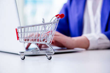 Businesswoman buying online using plastic credit card