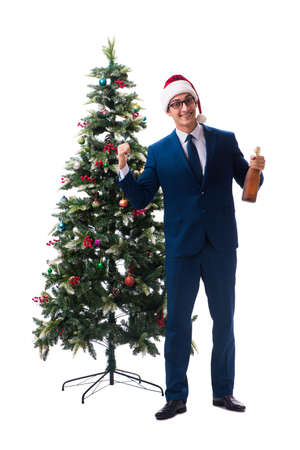 Businessman decorating christmas tree isolated on white backgroundの写真素材