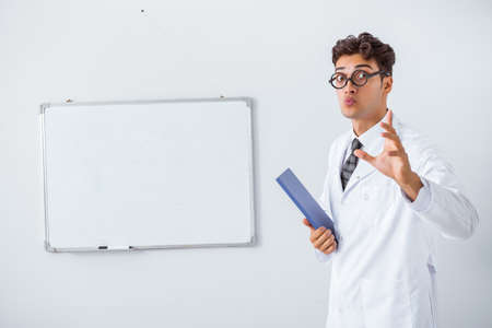 Funny doctor scientist making presentation in hospitalの写真素材