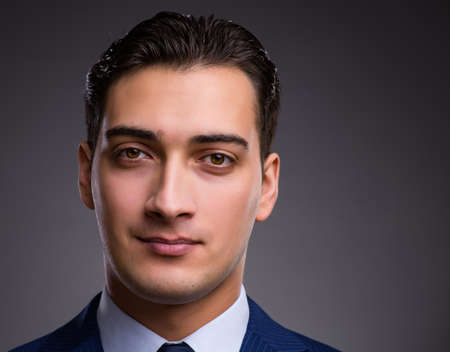 Portrait of young handsome businessmanの写真素材
