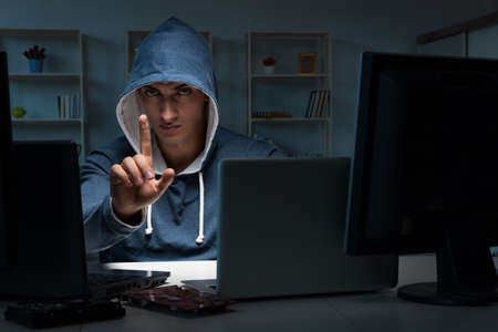 Hacker hacking computer at night