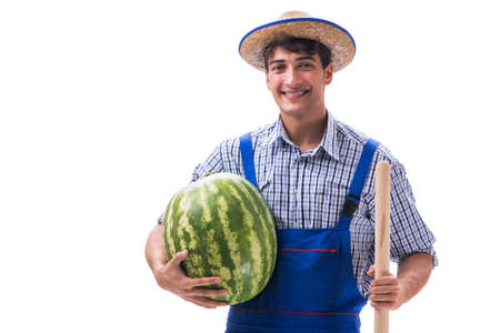 Young farmer with watermelon isolated on whiteの写真素材
