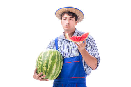 Young farmer with watermelon isolated on whiteの写真素材