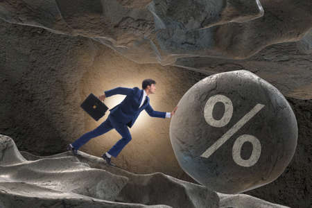 Businessman in high interest debt business conceptの写真素材