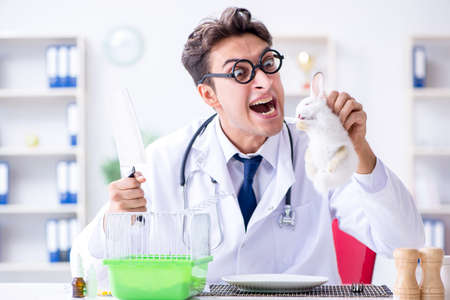 Mad crazy doctor preparing to eat rabbitの写真素材