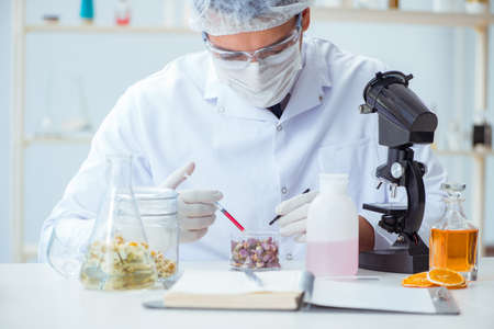Chemist mixing perfumes in the lab