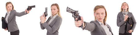 Businesswoman with gun isolated on whiteの写真素材
