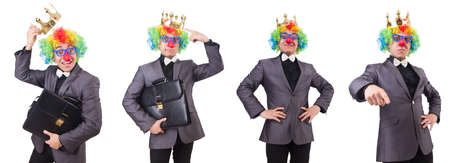 Businessman with crown isolated on whiteの写真素材