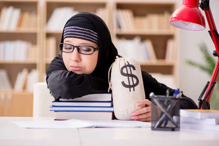 Muslim girl in hijab studying preparing for examsの写真素材