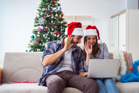 Happy couple celebrating christmas holidayの写真素材