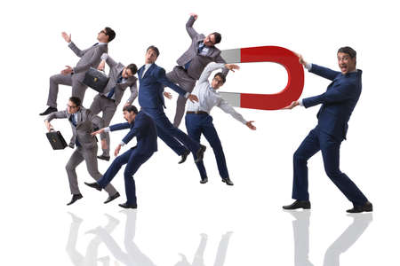 Businessman in recruitment concept with horseshoe magnet