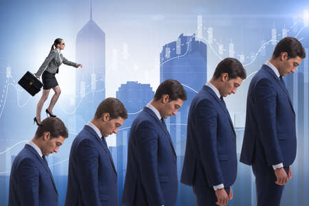 Business people climbing career ladder in business conceptの写真素材