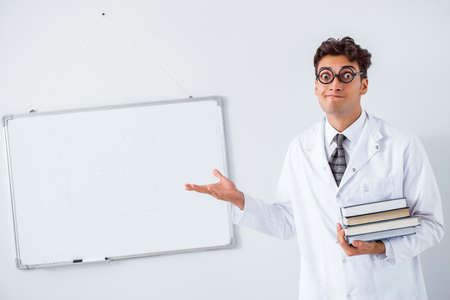 Funny doctor scientist making presentation in hospitalの写真素材