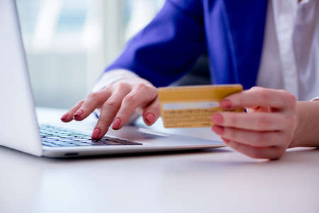 Woman buying online with credit plastic cardの写真素材