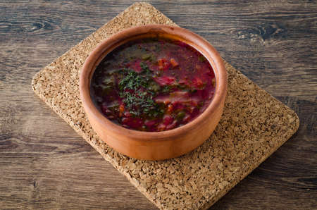 Bowl of traditional soup Borscht on tableの写真素材