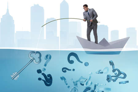 Businessman fishing questions from paper boat shipの写真素材