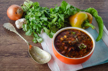 Bowl of traditional soup Borscht on table