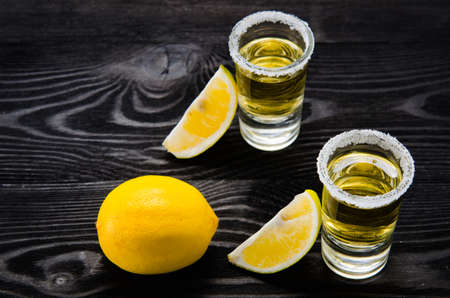 Tequila drink served in glasses with lime and saltの写真素材