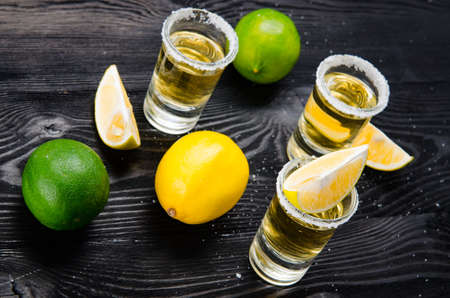 Tequila drink served in glasses with lime and saltの写真素材