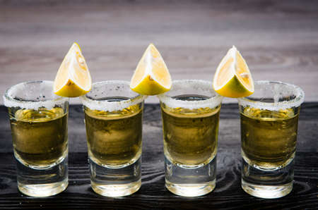 Tequila drink served in glasses with lime and saltの写真素材