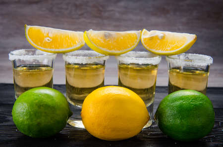 Tequila drink served in glasses with lime and saltの写真素材