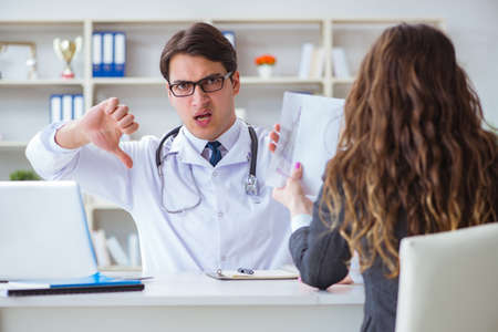 Young doctor in medical insurance fraud conceptの写真素材