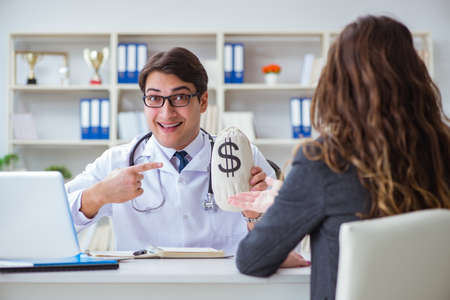 Young doctor in medical insurance fraud conceptの写真素材