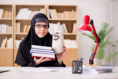 Muslim girl in hijab studying preparing for examsの写真素材