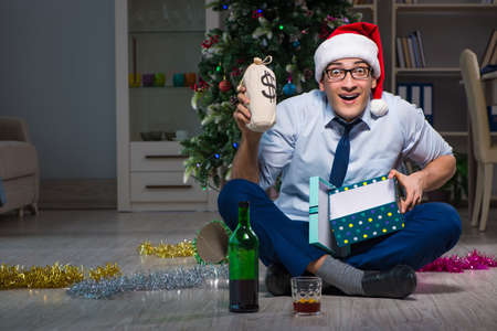 Businessman celebrating christmas at home aloneの写真素材