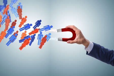 Businessman in recruitment concept with horseshoe magnetの写真素材