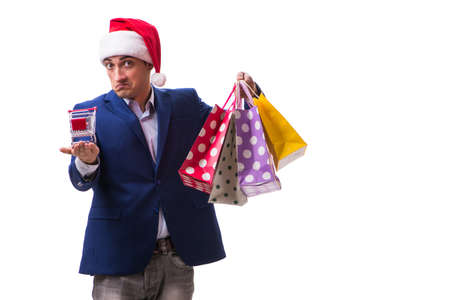 Young man with bags after christmas shopping on white backgroundの写真素材