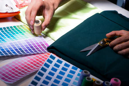 Male tailor working in sewer shopの写真素材