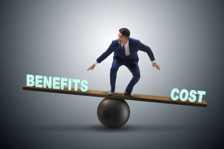 Businessman balancing between cost and benefit in business conce