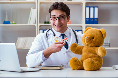 Doctor veterinary pediatrician holding an examination in the offの写真素材
