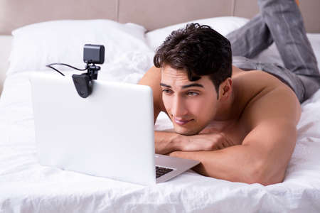 Young sexy man in online dating conceptの写真素材