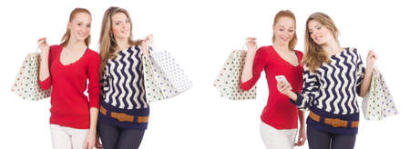 Friends with shopping bags isolated on white