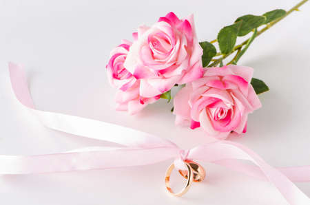 Wedding concept with rings and rosesの写真素材