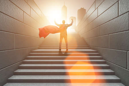 Businessman superhero successful in career ladder conceptの写真素材