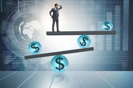 Businessman balancing in financial dollar conceptの写真素材