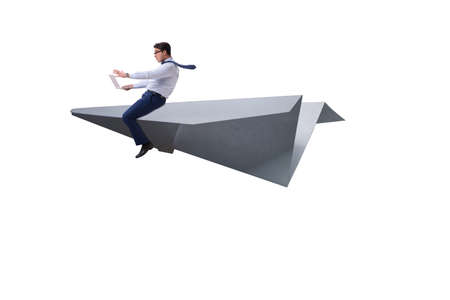 Businessman flying on paper plane in business conceptの写真素材