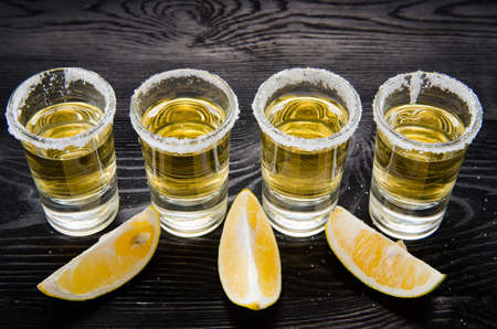 Tequila drink served in glasses with lime and saltの写真素材