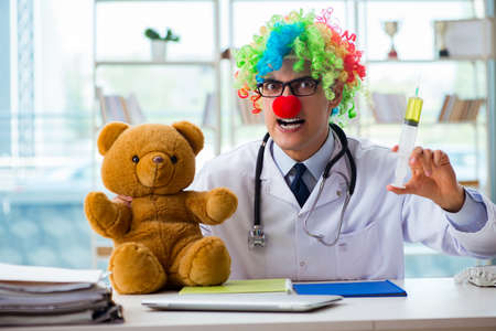 Funny pediatrician with toy in the hospital clinicの写真素材
