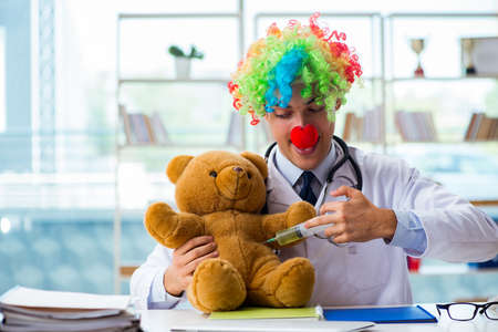 Funny pediatrician with toy in the hospital clinicの写真素材