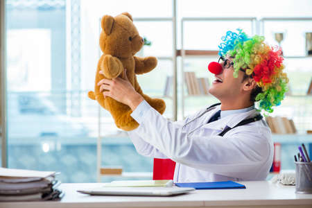 Funny pediatrician with toy in the hospital clinicの写真素材