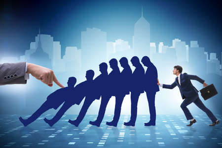 Businessman in domino effect business conceptの写真素材
