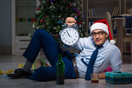 Businessman celebrating christmas at home aloneの写真素材