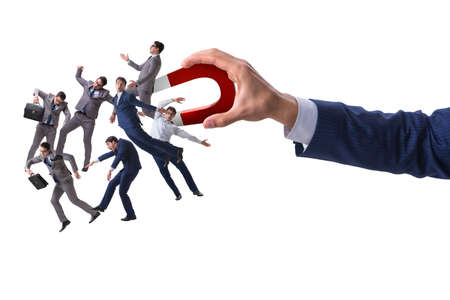 Businessman in recruitment concept with horseshoe magnetの写真素材