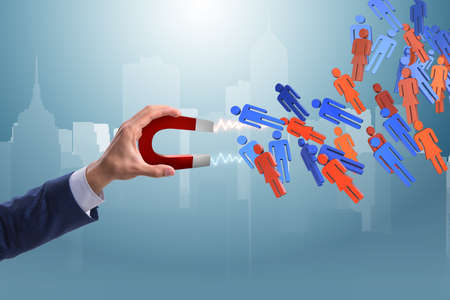 Businessman in recruitment concept with horseshoe magnetの写真素材