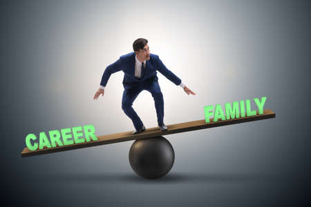 Businessman balancing between career and family in business concの写真素材
